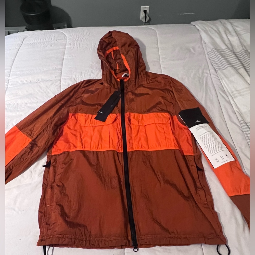 Stone island jacket.  “Nylon metal watro ripstop”